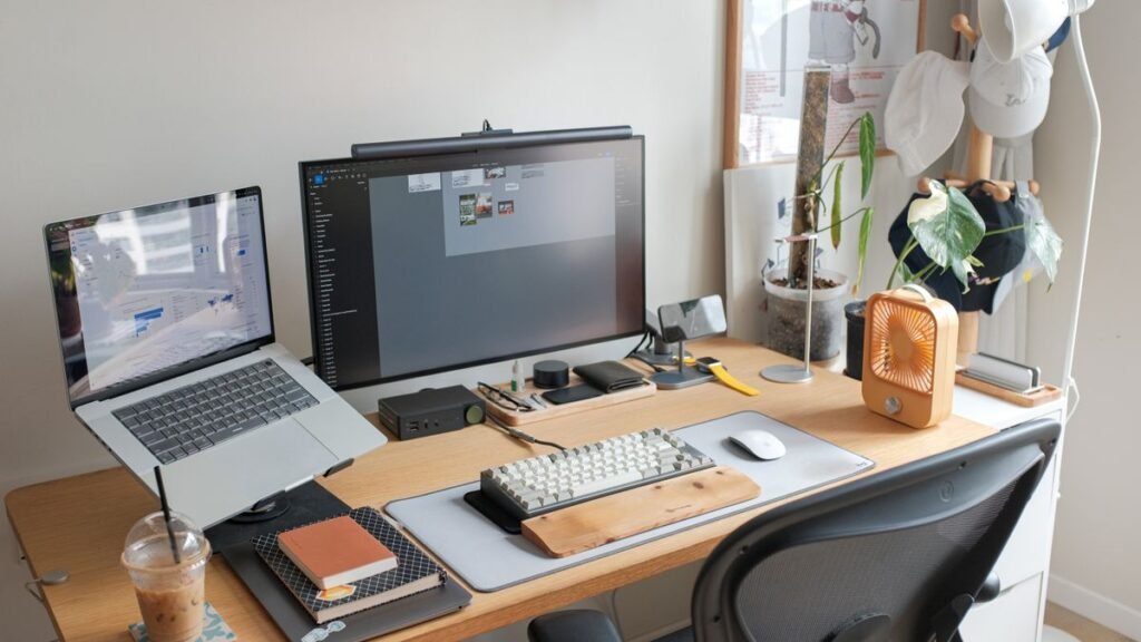Creator desk with laptop and monitor for designing a media kit