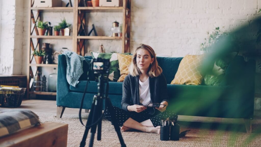 Creator filming a video at home with a camera