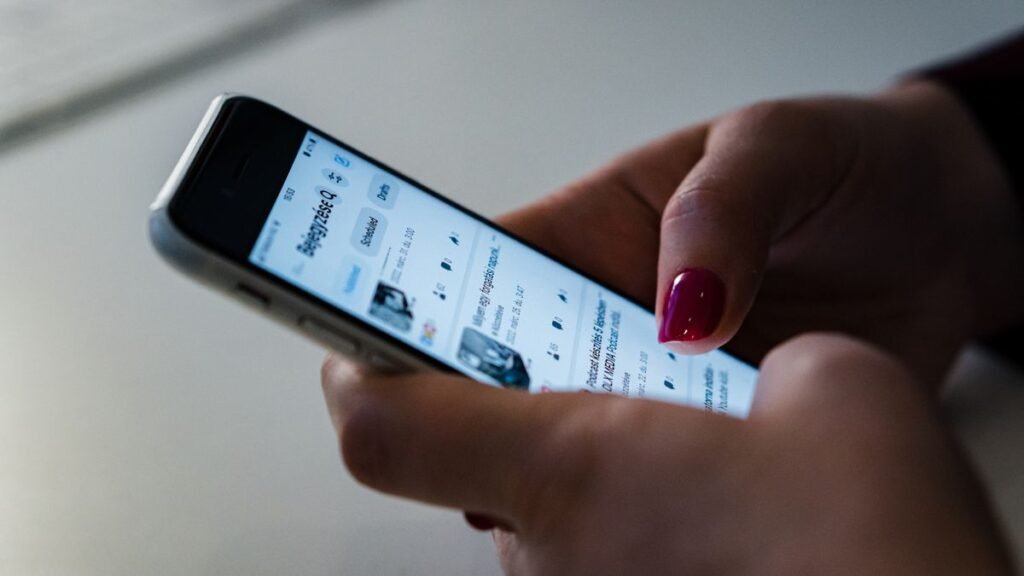 Person scrolling short videos on a smartphone